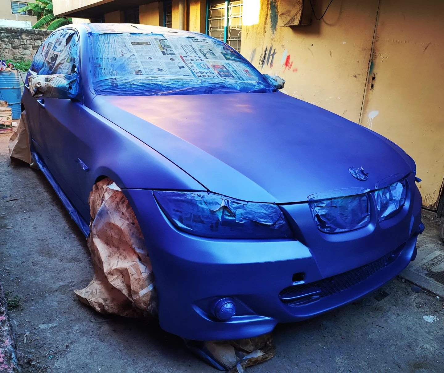 Matte blue BMW mid-respray in the Setik workshop